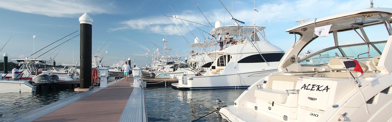 Sportfishing boats docked at Vista Mar Marina with outriggers raised
